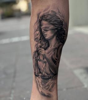 Realism blindfolded justice tattoo by @mia.ink._