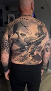 Realism warplane battle tattoo by @michal_zak_tattoo