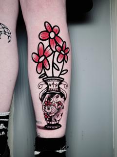 Traditional flower vase tattoo by @miguel.tattooer