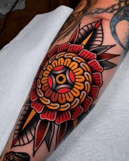 Traditional traditional flower tattoo by @morstattoo