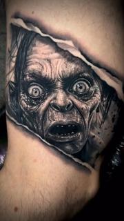 Black and grey realism gollum portrait tattoo by @mortenstubbe_tattoos