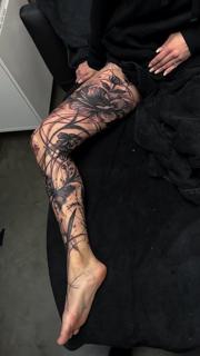 Blackwork floral leg sleeve tattoo by @natalienox