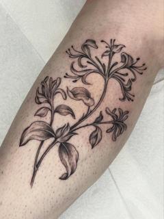 Fine line floral branch tattoo by @nel.does.tats