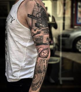 Realism cityscape sleeve tattoo by @nickfarbeyond