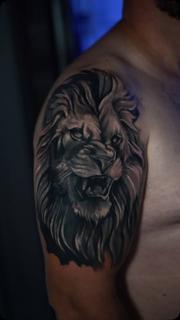 Realism lion portrait tattoo by @nikoselmaidis_tattoo