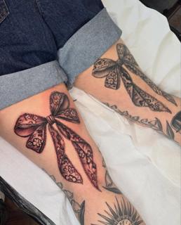 Realism lace bow tattoo by @paigehutchinson_tattoo