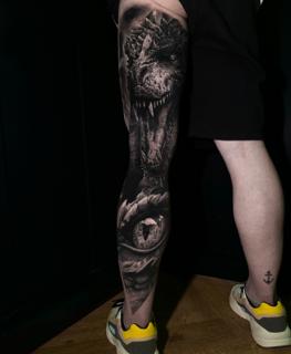Realism dinosaur portrait tattoo by @dast.one