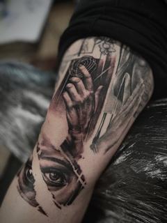 Realism surreal eye hand tattoo by @panayiotis_so