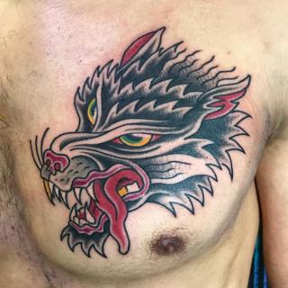 Traditional wolf head tattoo by @ksr_junx