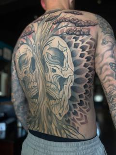 Blackwork tree skulls tattoo by @parispamelatattoo