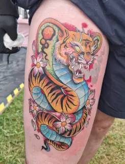 Neo-traditional tiger snake flowers tattoo by @mrdbtattoo