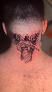Realism angel with gun tattoo by @kulo_tattoo_art