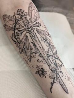 Fine line sword and flowers tattoo by @penelopetentakles