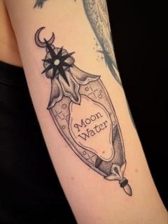 Blackwork moon water bottle tattoo by @poppyoliviatattoo