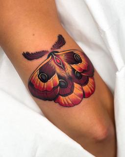 Traditional moth tattoo by @psyhiskond