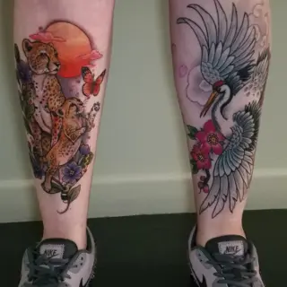 Color realism cheetah and crane tattoo by @purplerosebristol