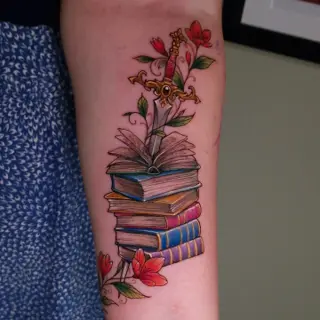 Illustrative sword and books tattoo by @purplerosebristol