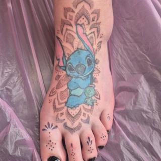 Anime stitch character tattoo by @rachaelmarie.floraink