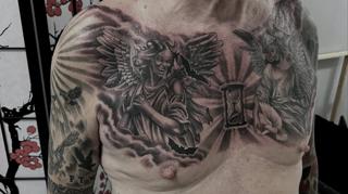 Dark realism angel demon hourglass tattoo by @rafaels_art_and_tattoo