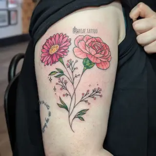 Illustrative floral sprigs tattoo by @beccaf.tattoo