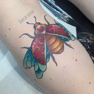 Neo-traditional ornate beetle tattoo by @beccaf.tattoo