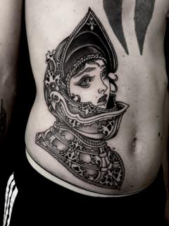 Blackwork woman in armor tattoo by @robert_w_ashby