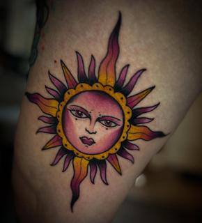 Traditional sun face tattoo by @robertcresswell28