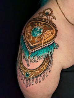 Ornamental ornate pendant tattoo by @rocio_todisco