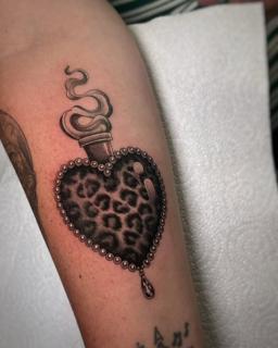 Illustrative leopard heart tattoo by @rosiemalonetattoos
