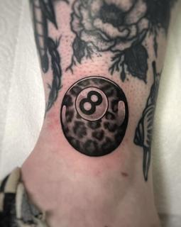 Realism magic 8 ball tattoo by @rosiemalonetattoos