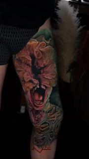 Realism monster face tattoo by @sambarbertattoo