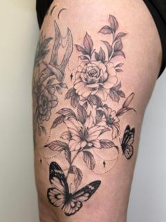 Fine line floral butterfly tattoo by @samclaridgetattoos