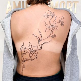 Fine line floral vine tattoo by @sasha7tattoos