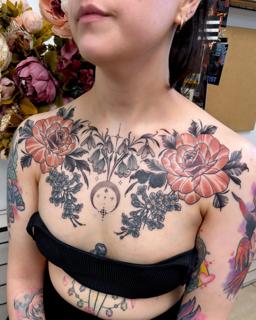 Fine line floral chest piece tattoo by @miss.saskiatattoo