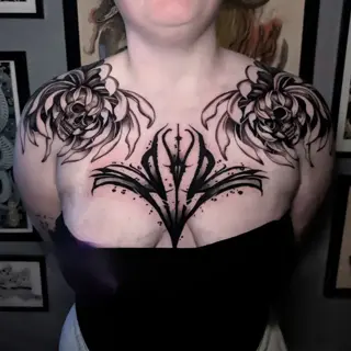 Blackwork floral skulls tattoo by @rayne.tattoos