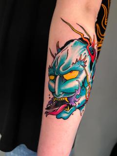 Neo-traditional demon mask tattoo by @the_cutter_tattooer