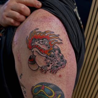 Traditional flaming toad tattoo by @shrddr_tattoo