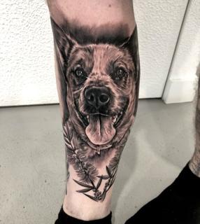Realism floral dog portrait tattoo by @shayne.r.tattoos