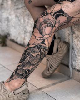 Blackwork bird and floral tattoo by @shoutone_
