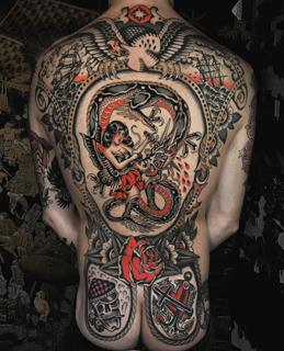 Traditional traditional backpiece tattoo by @siggytattoo