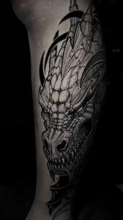 Illustrative dragon head tattoo by @slimmoxmooreblackwork