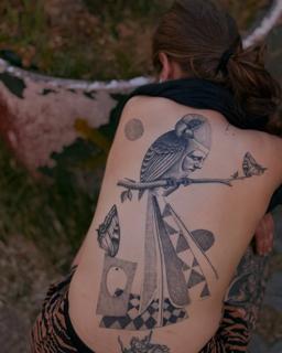 Illustrative parrot face tattoo by @_avlamis
