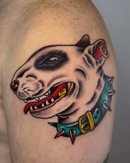 Traditional dog head tattoo by @stef_mits_tattoo
