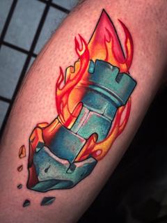 Illustrative burning tower tattoo by @stelios.linas