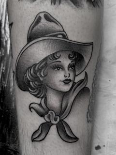 Traditional cowgirl portrait tattoo by @stephenkellytattoo