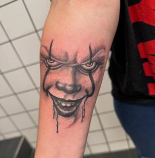 Realism creepy clown tattoo by @tattoozbysteve