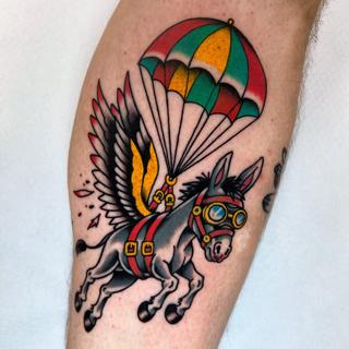 Traditional parachuting donkey tattoo by @stoyjunx
