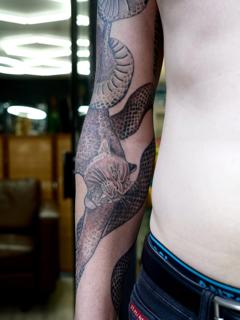 Realism leopard snake tattoo by @suzetattoos