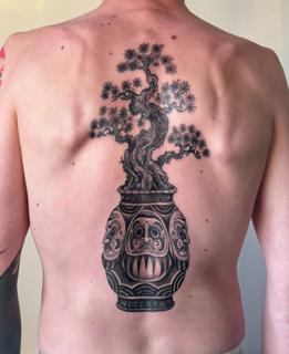 Blackwork bonsai in vase tattoo by @suzetattoos
