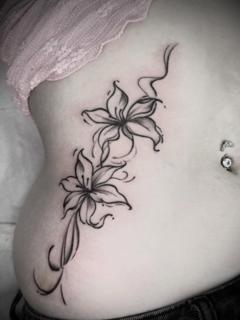 Blackwork floral lilies tattoo by @tattooinestudios